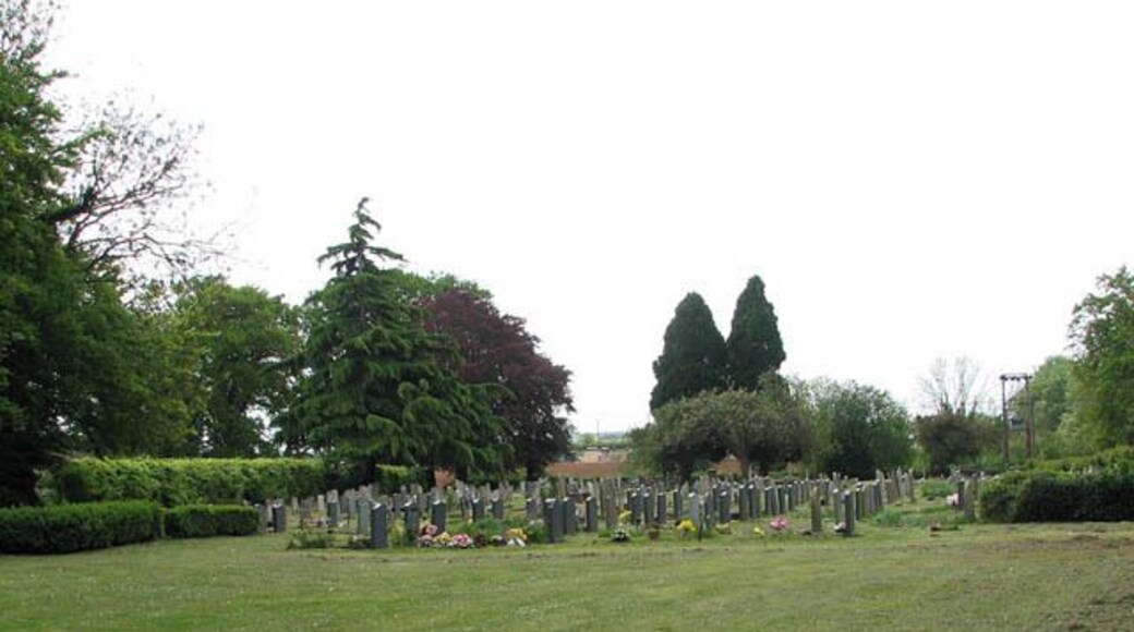 New cemetery east of St Mary's church. The new section of the churchyard is separated from the old by a track called Eaton Drove > 1300331.