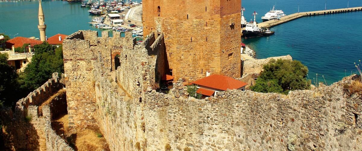 The Kızıl Kule (Red Tower) is a 13th-century tower in the Turkish city of Alanya. Part of Alanya Castle, the tower is considered to be the symbol of the city. And it's definitely one of the most impressive sights in Alanya :). One of my highlights of Summer 2018!
And more about the Red Tower: Being one of the unique examples of the medieval Mediterranean defense structure from 13th century, Red Tower was built by order of Alaeddin Keyqubad I, the Seljuk ruler, to Ebu Ali Reha el Kettani who was a master builder from Aleppo in order to protect harbor, shipyard and Alanya Castle against attacks from the sea. And the castle was built on the remnants of earlier Byzantine era and Roman era fortifications.