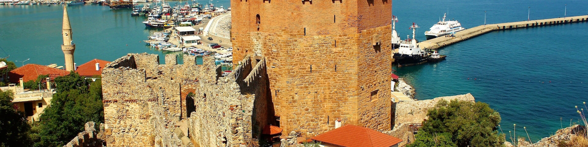 The Kızıl Kule (Red Tower) is a 13th-century tower in the Turkish city of Alanya. Part of Alanya Castle, the tower is considered to be the symbol of the city. And it's definitely one of the most impressive sights in Alanya :). One of my highlights of Summer 2018!
And more about the Red Tower: Being one of the unique examples of the medieval Mediterranean defense structure from 13th century, Red Tower was built by order of Alaeddin Keyqubad I, the Seljuk ruler, to Ebu Ali Reha el Kettani who was a master builder from Aleppo in order to protect harbor, shipyard and Alanya Castle against attacks from the sea. And the castle was built on the remnants of earlier Byzantine era and Roman era fortifications.