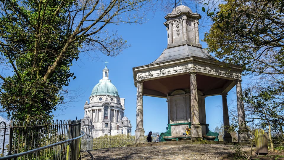 A gazebo and a church with a dome.