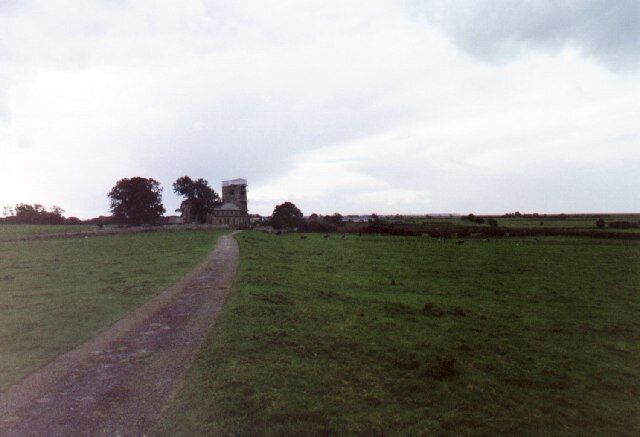 The field path to St. Michael's Church, Cockerham. The church is beautifully situated in the middle of a field in open countryside.