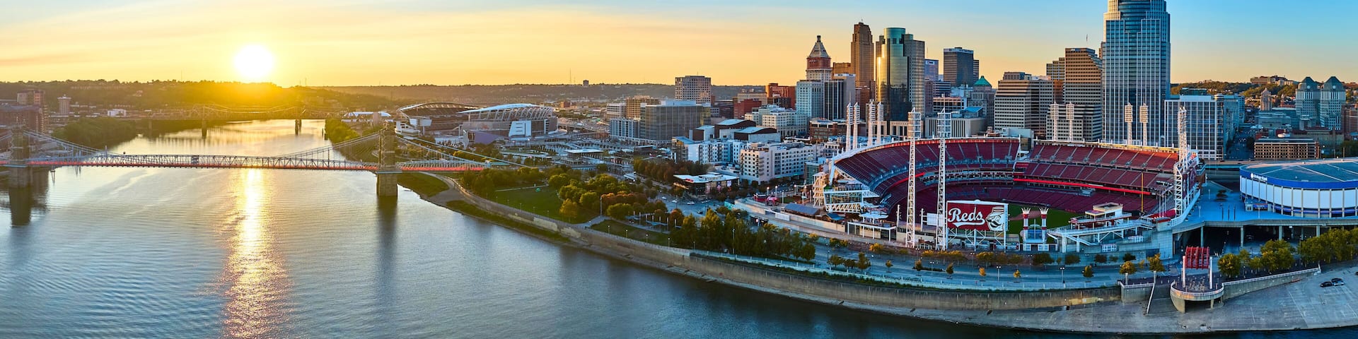 Aerial Panorama Cincinnati Skyline Sunset with Ohio River and Bridge