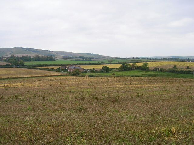Farmland Around Spring Gardens The terraced cottages are named after Spring Ditch, a small tributary of Glynde Reach. Beddingham Hill is in the background whilst the hedge running left to right marks the A27.
