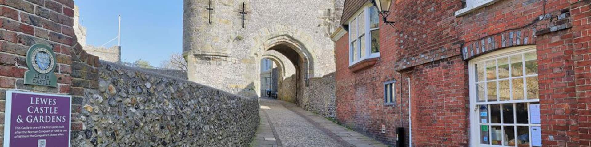 The entrance to Lewes Castle in East Sussex, England which stands at the highest point of the town on an artificial mound constructed with chalk blocks.
Built in 1069 by William de Warenne the first Earl of Surrey it is one of only two remaining that are based upon the motte and bailey construction.
Its open daily to the public and commands some great views across the countryside, including the Harvey's Brewery which is located in Lewes.