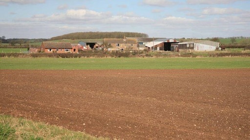 Farm yard across the fields As seen from the Cotes Road