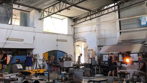 View from inside the Mdina Glass glassblowing studio in the country of Malta. Dating from 1968, this studio was the first glassblowing studio ever in Malta.