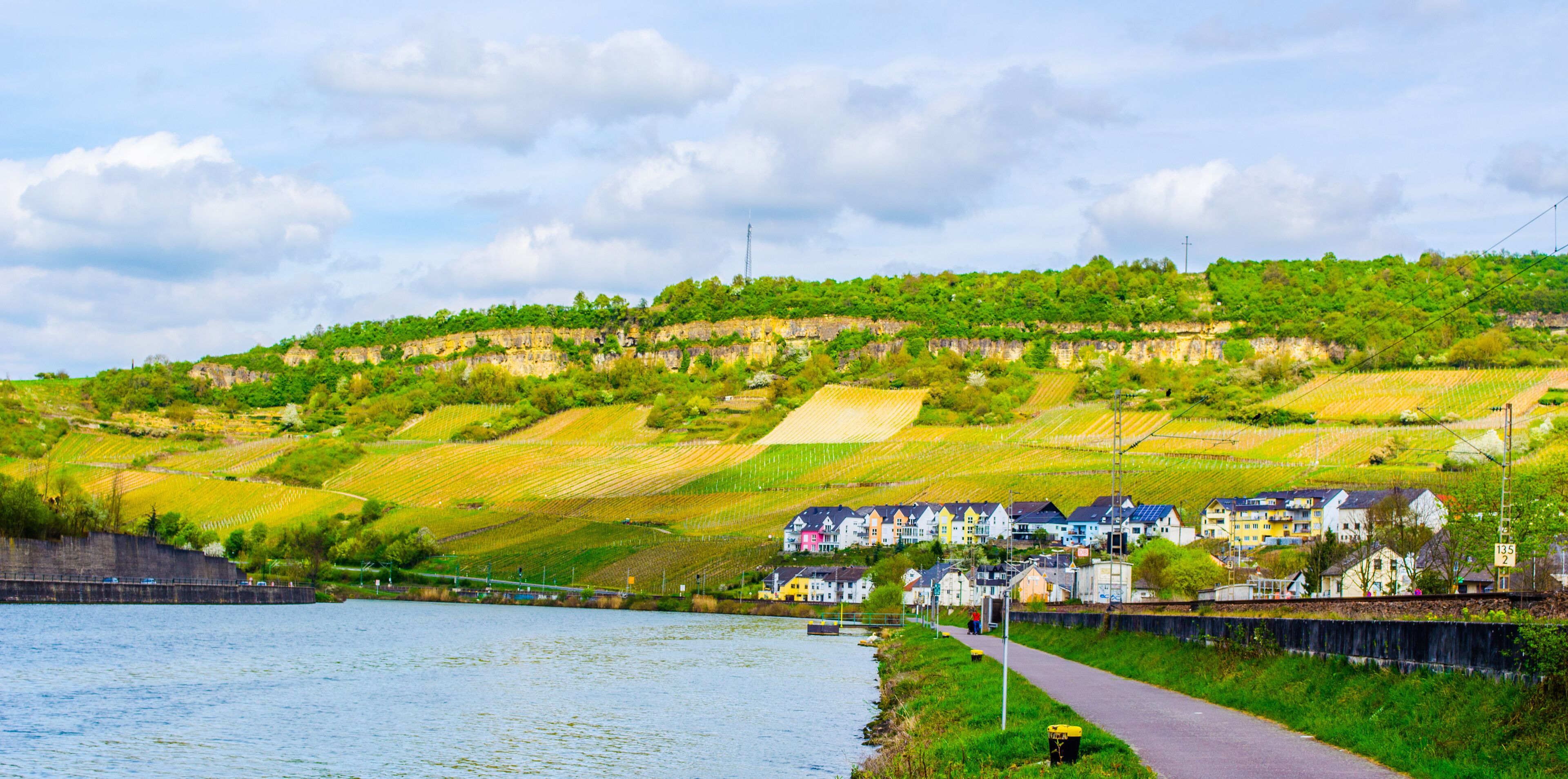 Moselle river flowing through wine heart of luxembourg and passing many small villages.