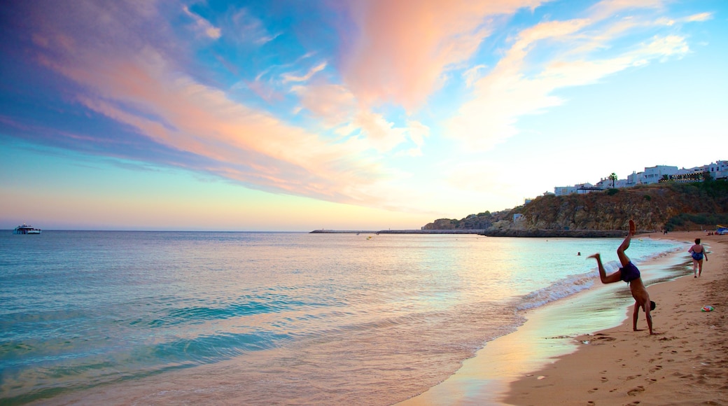 Albufeira which includes landscape views and a beach as well as an individual male
