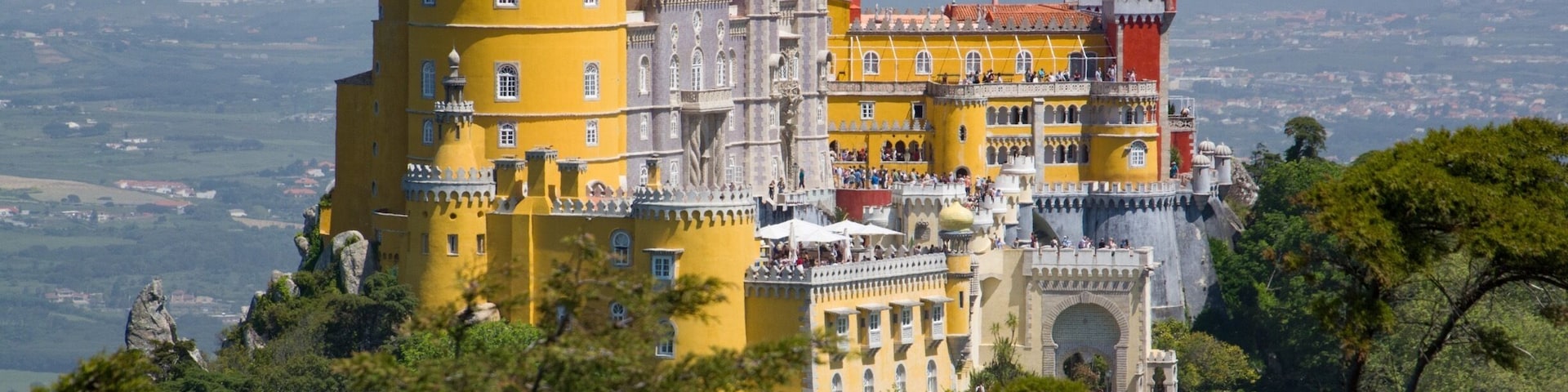 If you visit Sintra, Portugal, be sure to visit Palacio Pena. The walk leading up to the palace is just stunning.
