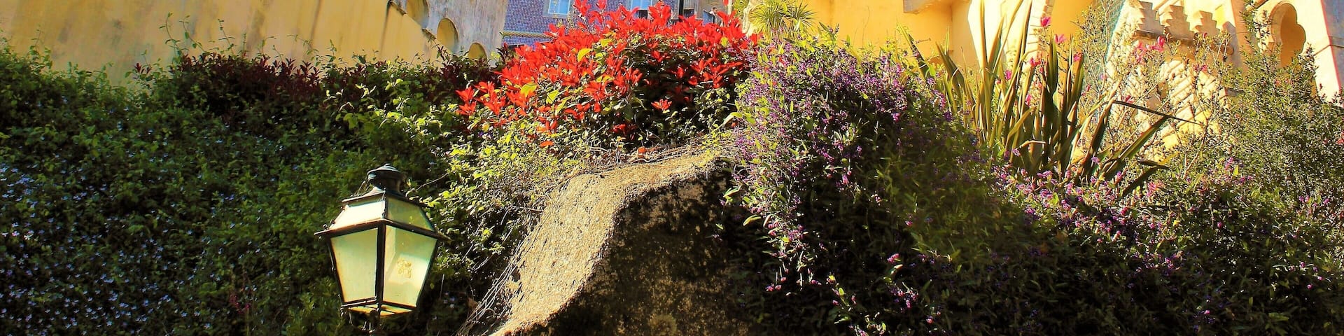 I took this in March in Sintra, Portugal! It's at the fairy tale castle Pena Palace :). This is one of the lovely close-up views. It's is a Romanticist castle that stands on the top of a hill in the Sintra Mountains. And undoubtedly one of the most iconic places in Portugal. And a dream come true to visit it! It is a national monument and constitutes one of the major expressions of 19th-century Romanticism in the world. The palace is a UNESCO World Heritage Site and one of the Seven Wonders of Portugal. It is also used for state occasions by the President of the Portuguese Republic and other government officials. Thanks to Wikipedia for help ;).
