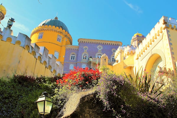 I took this in March in Sintra, Portugal! It's at the fairy tale castle Pena Palace :). This is one of the lovely close-up views. It's is a Romanticist castle that stands on the top of a hill in the Sintra Mountains. And undoubtedly one of the most iconic places in Portugal. And a dream come true to visit it! It is a national monument and constitutes one of the major expressions of 19th-century Romanticism in the world. The palace is a UNESCO World Heritage Site and one of the Seven Wonders of Portugal. It is also used for state occasions by the President of the Portuguese Republic and other government officials. Thanks to Wikipedia for help ;).