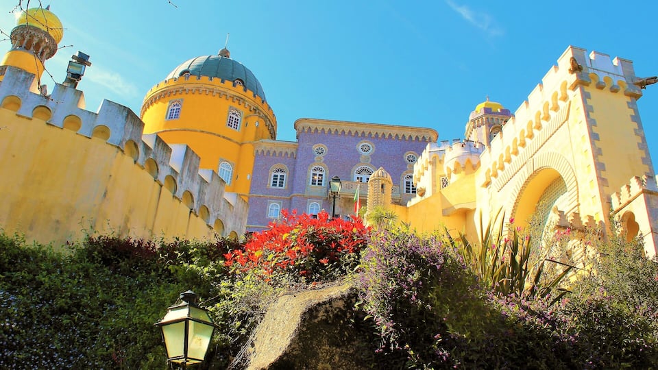 I took this in March in Sintra, Portugal! It's at the fairy tale castle Pena Palace :). This is one of the lovely close-up views. It's is a Romanticist castle that stands on the top of a hill in the Sintra Mountains. And undoubtedly one of the most iconic places in Portugal. And a dream come true to visit it! It is a national monument and constitutes one of the major expressions of 19th-century Romanticism in the world. The palace is a UNESCO World Heritage Site and one of the Seven Wonders of Portugal. It is also used for state occasions by the President of the Portuguese Republic and other government officials. Thanks to Wikipedia for help ;).