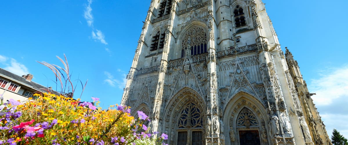 A Gothic cathedral with intricate stonework and large arched windows.