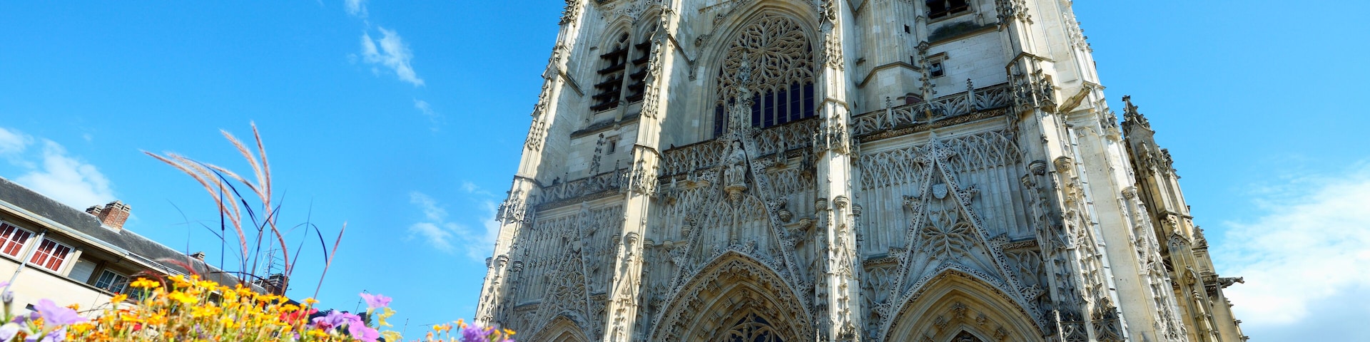 A Gothic cathedral with intricate stonework and large arched windows.