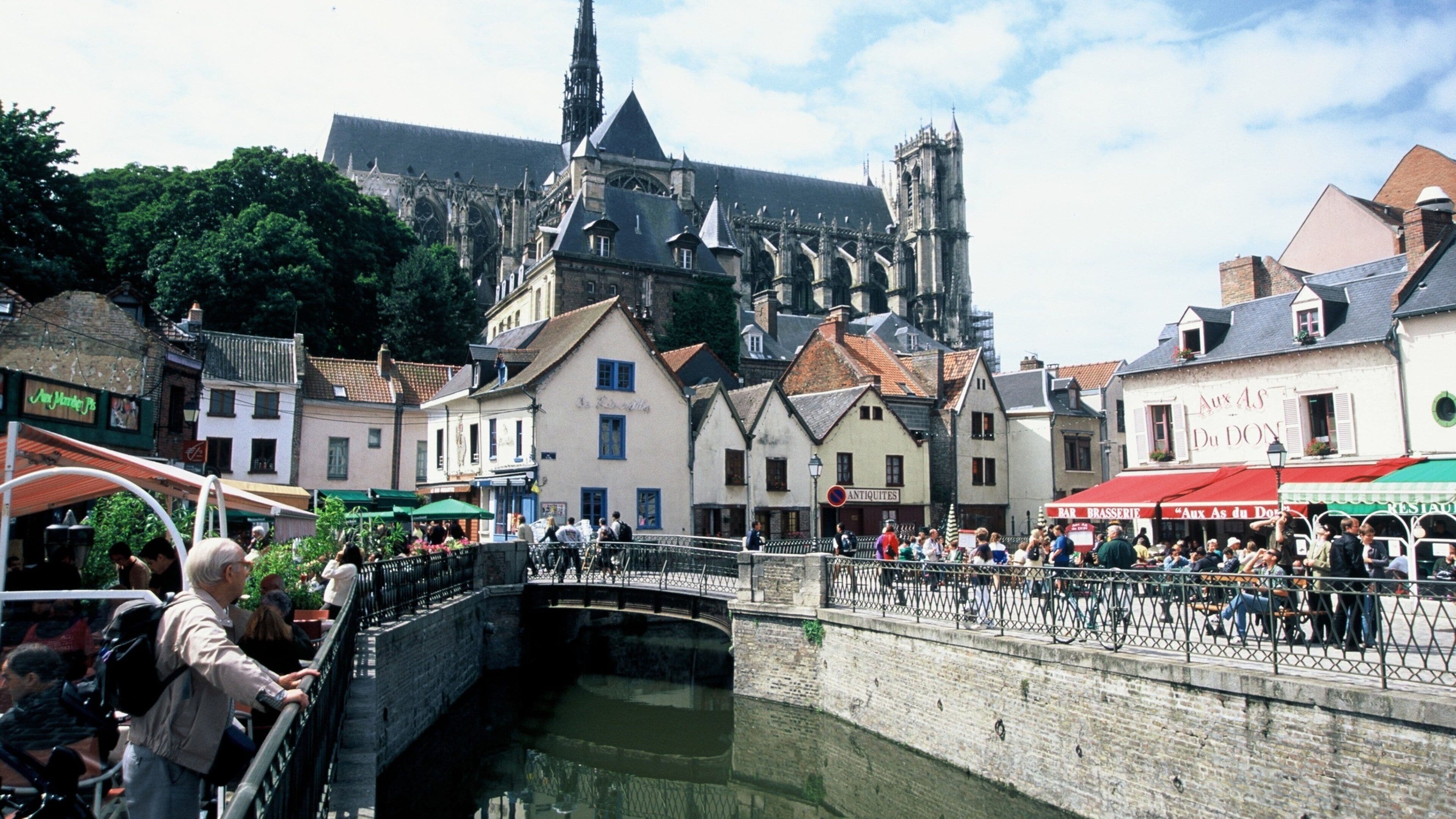 Amiens showing street scenes, a river or creek and a church or cathedral