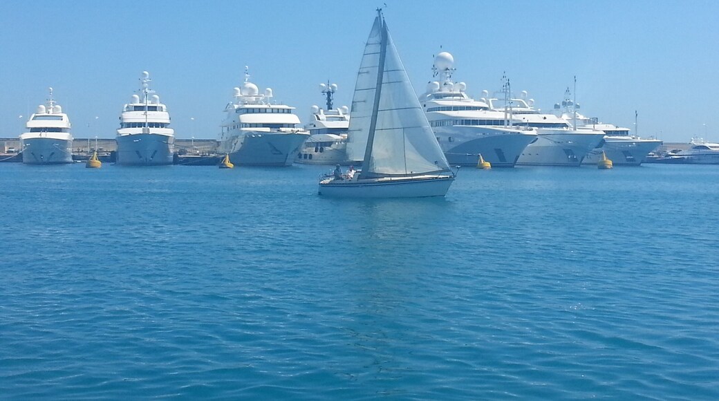 Gorgeous motor yachts docked along the Millionaires Port in Antibes when along passes a beautiful sailing yacht...