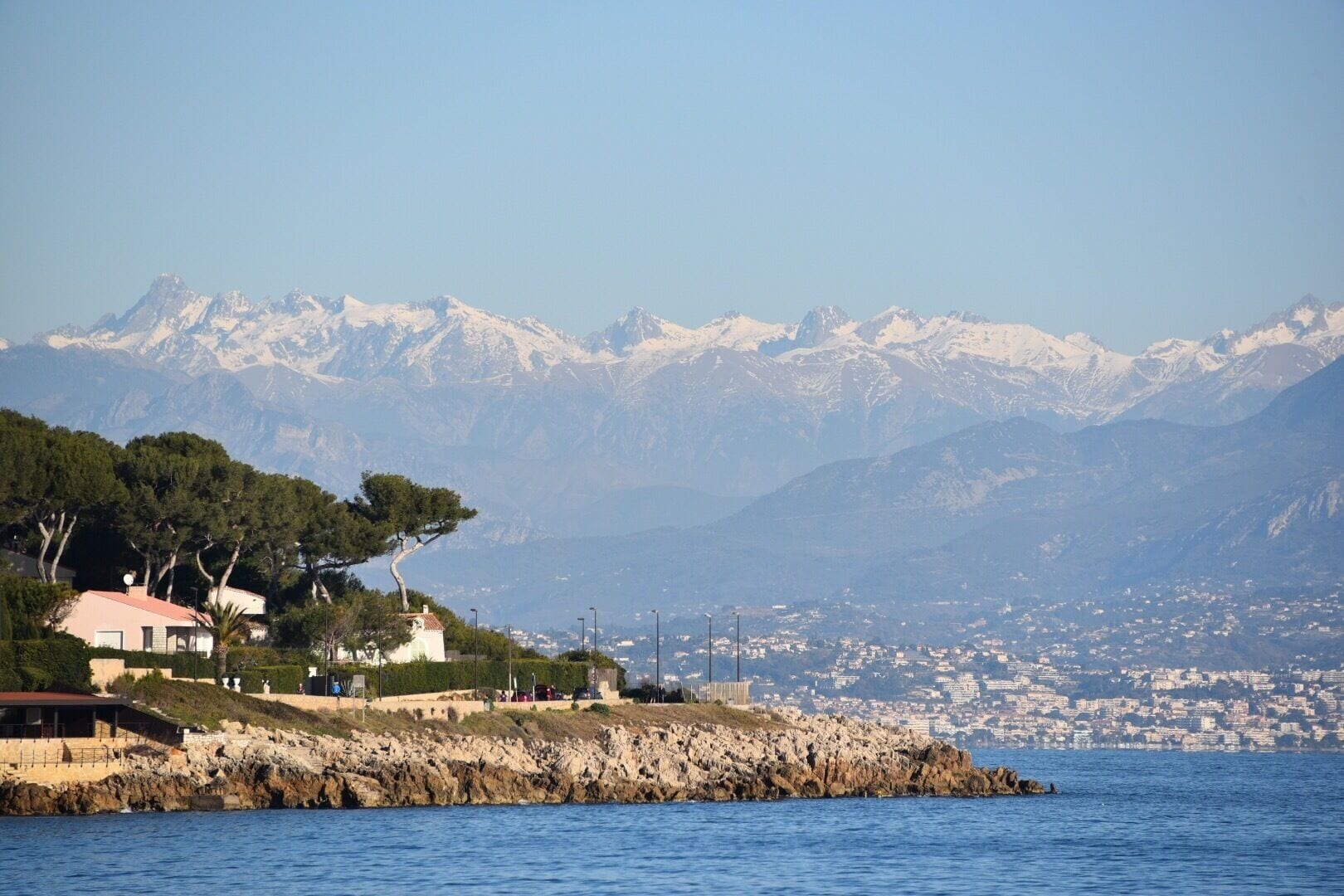 Walk along the sea with view of the mountains. 