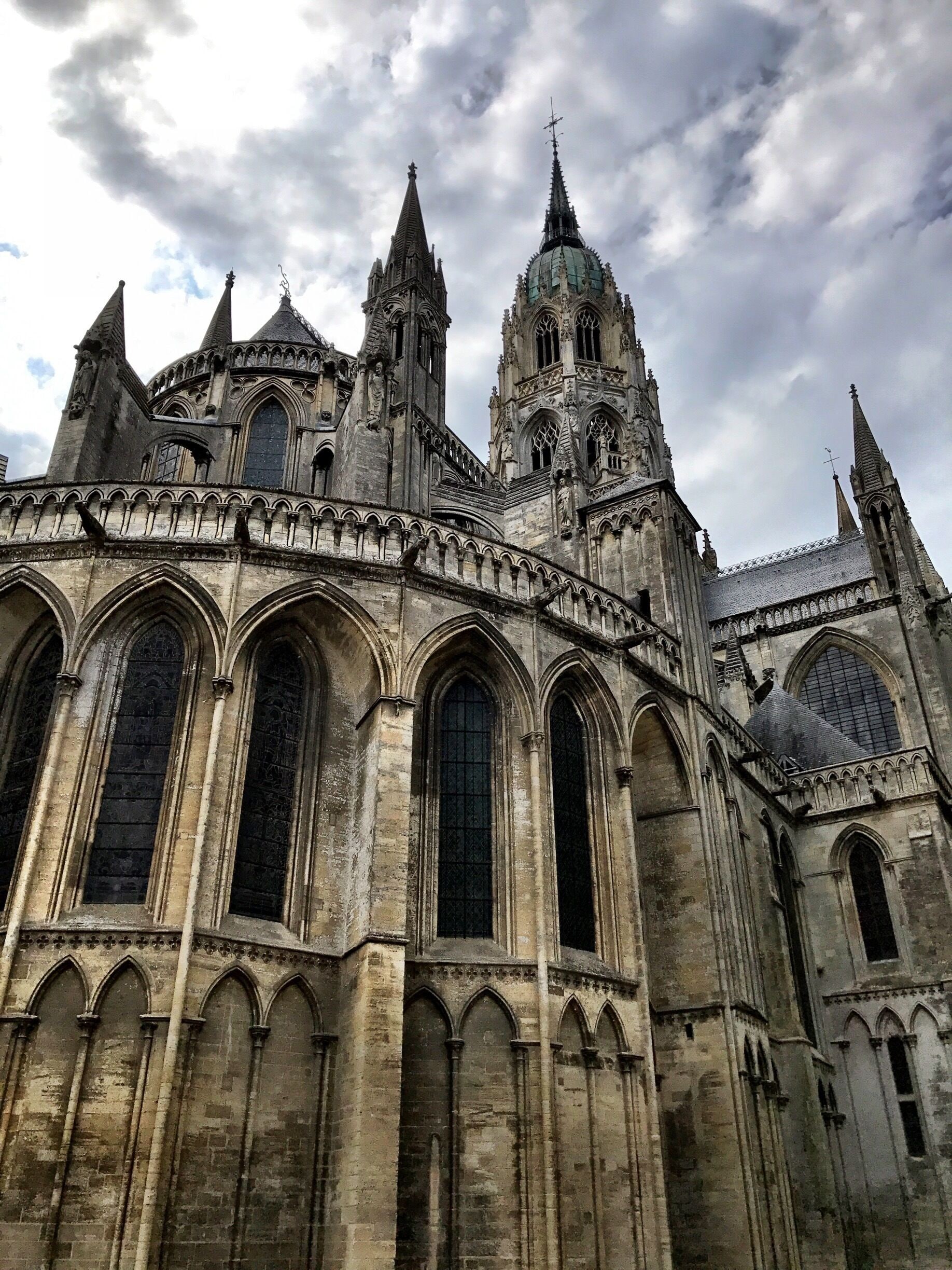 A Gothic cathedral with pointed arches, large stained glass windows, and multiple spires.