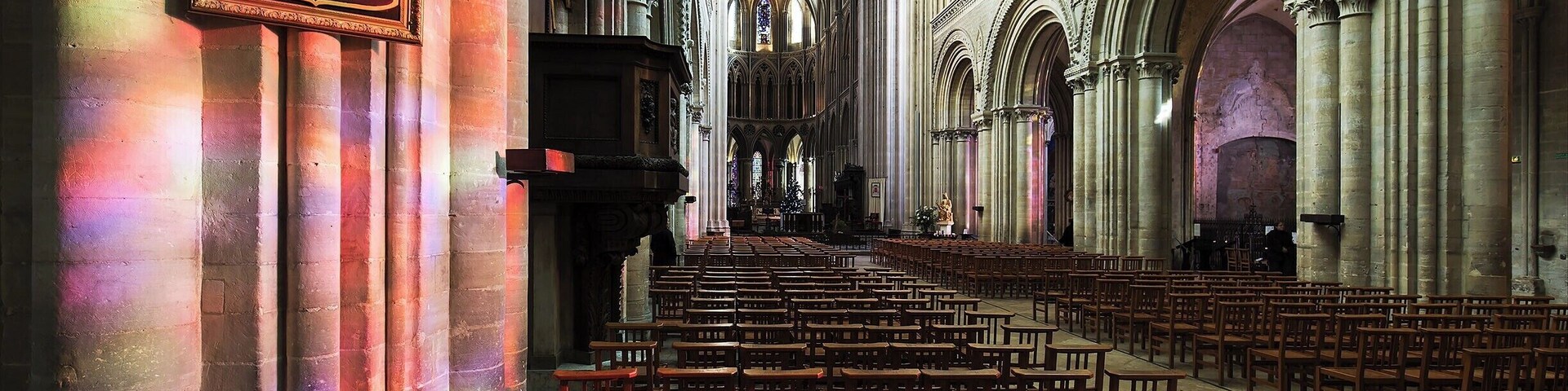 Step inside this church to stand where William the Conqueror stood 940 years ago. Once inside, imagine the 230ft long Bayeux Tapestry encircling the nave, telling the story in vivid embroidery of how William defeated Harold at the Battle of Hastings and became King of England.
As a bonus, if you catch it at the right time of day, the sunlight streams through the stained glass and creates colorful patterns on the stone.