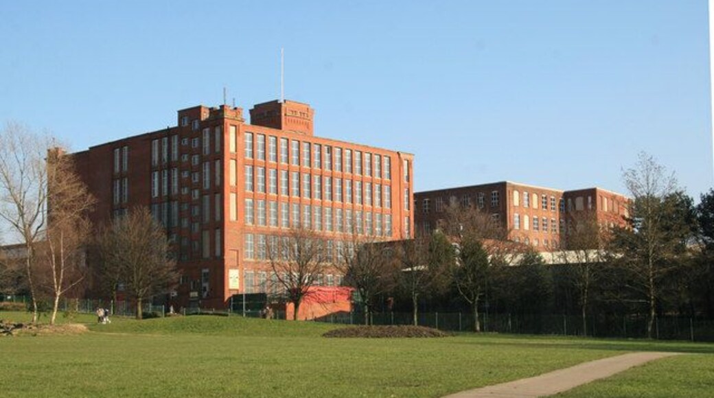 Osborne Mills, Chadderton Pair of mills on Osborne and Waddington Streets. No. 1 (back)was by A H Stott in 1873, extended 1891 and 1900, closed 1968. 66,008 spindles in 1910. No. 2 was by P S Stott in 1912 with 54,720 spindles. Also closed 1968. No. 1 had Petrie engines and then from 1920 a C A Parsons turbine. No. 2 had a 1200 hp Hick, Hargreaves. Now in multiple occupation.
