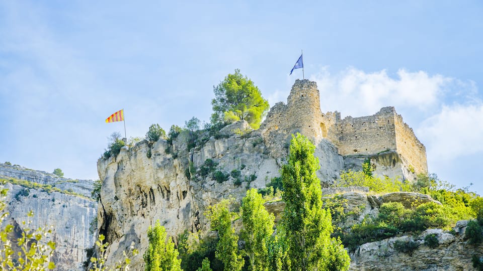 Ruins of the Castle of the Bishops of Cavaillon overlooking Fontaine de Vaucluse village in Provence, France