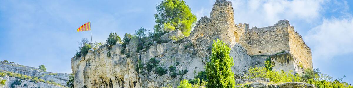 Ruins of the Castle of the Bishops of Cavaillon overlooking Fontaine de Vaucluse village in Provence, France