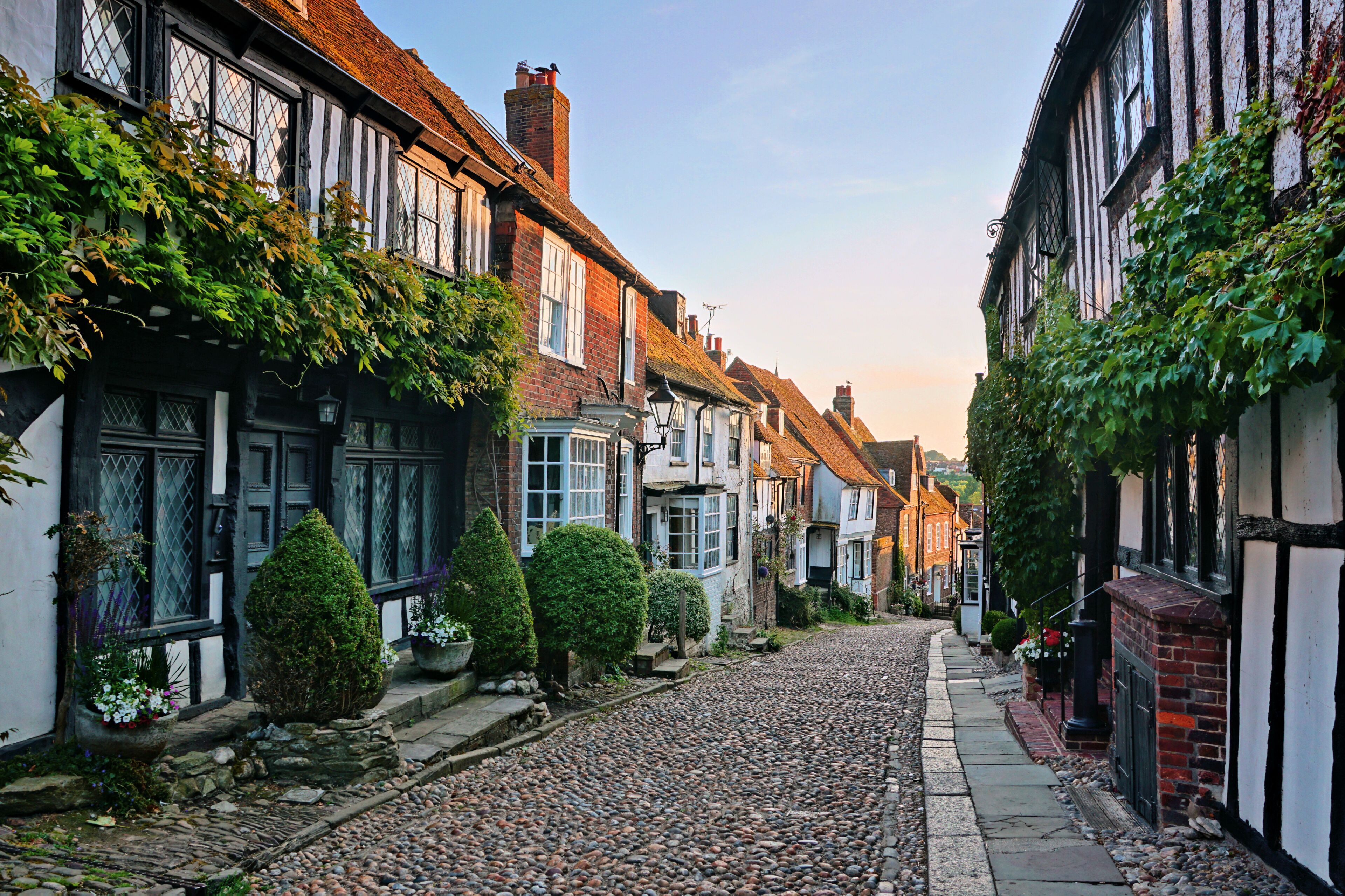 Beautiful cobblestone lane at dusk with medieval half timbered buildings, Rye, East Sussex, England
