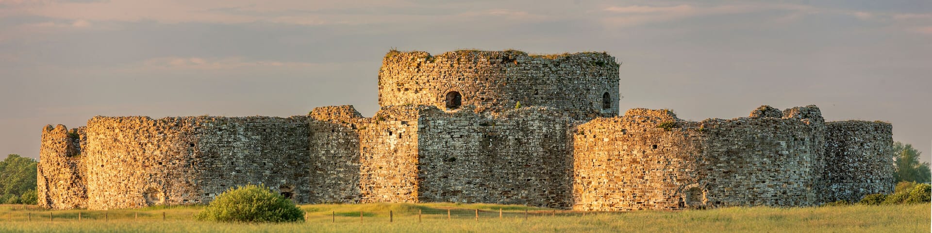 Camber Sands castle being bathed in the evening golden hour light near Rye East Sussex south east England UK