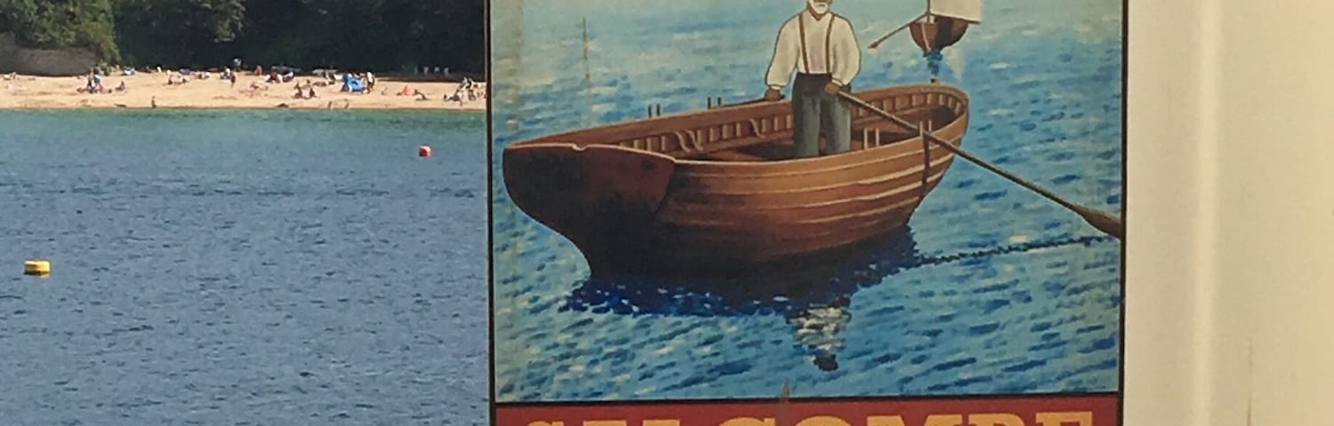 Placa do Ferry Inn em Salcombe com a ilustração de um homem em um barco na água.