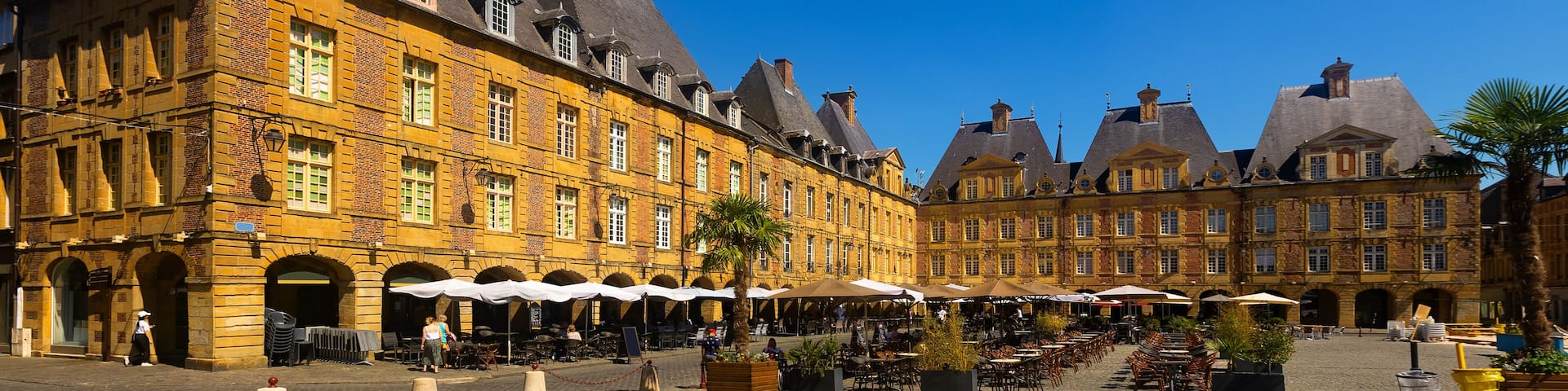 Summer view of central square place Ducale in French town of Charleville-Mezieres with surrounded by similar residential buildings with triangular gables