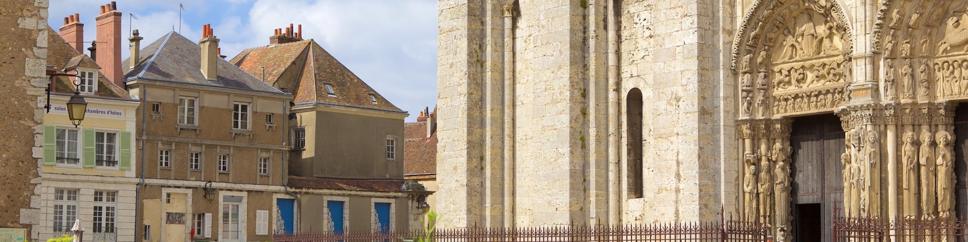 A historic building with intricate carvings and a tall tower.
