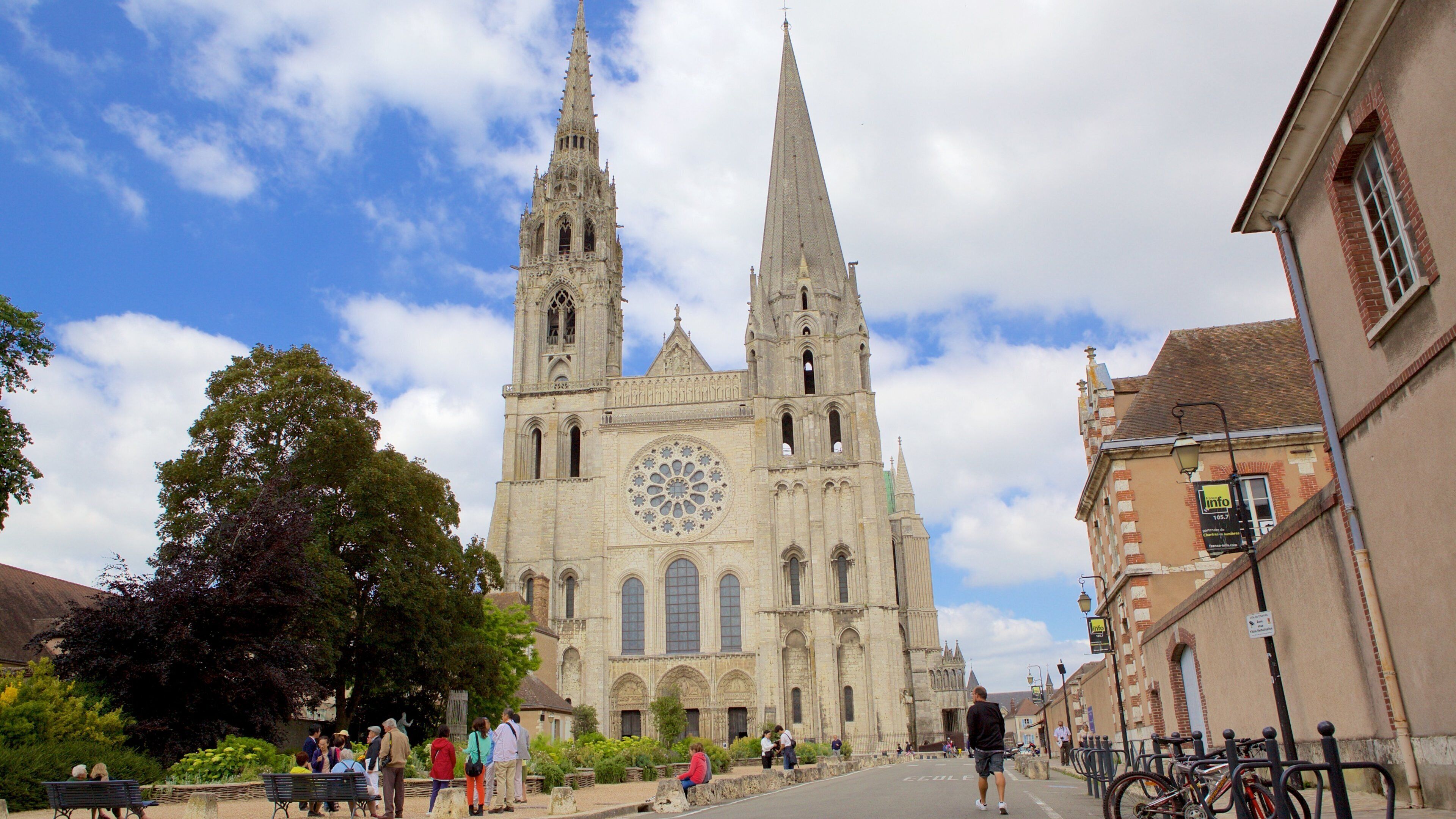 A historic cathedral with two tall spires and a large rose window.