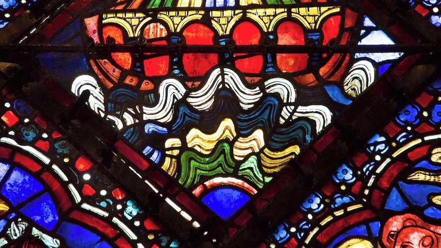 The ark floats! Stained glass panel from the Noah window. This is a very animated window, with people drowning, griffins disembarking, crows eating corpses, and God sitting on a rainbow!