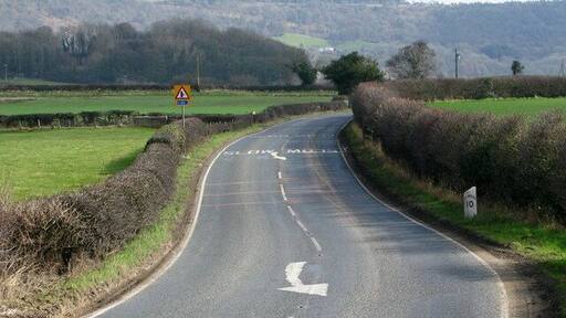 Sutton Under Whitestonecliffe Milepost Milepost located beside the A170 on the outskirts of the village. Sutton Bank is in the distance.