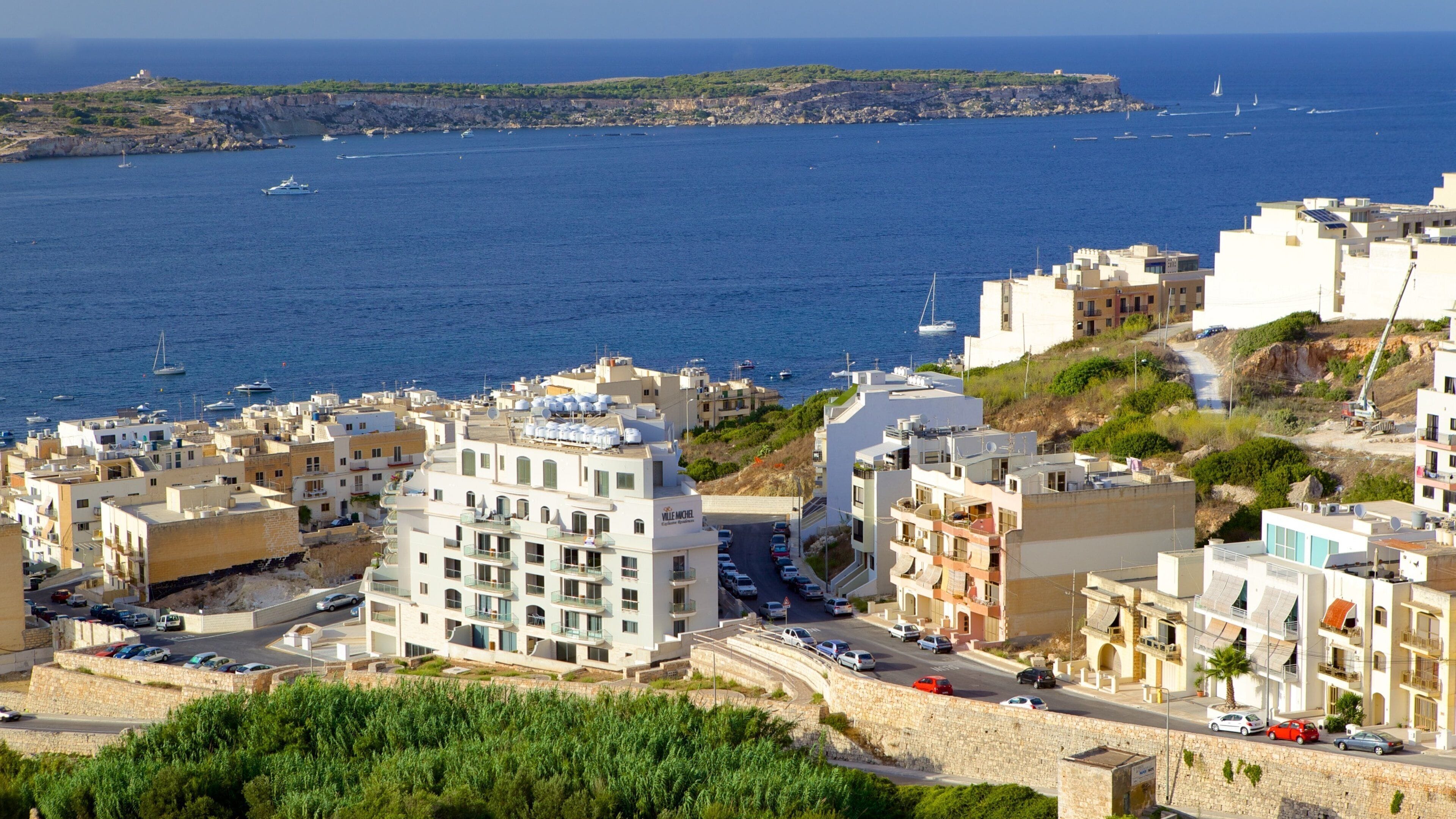 Malta featuring general coastal views, landscape views and a coastal town