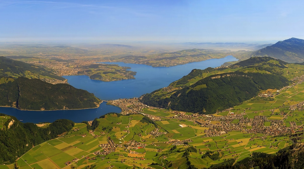 Magnificent panoramic aerial views of central Switzerland, mountains, Lake Lucerne as you ascend the Cabrio cable car up Mount Stanserhorn in Switzerland. City of Stans.