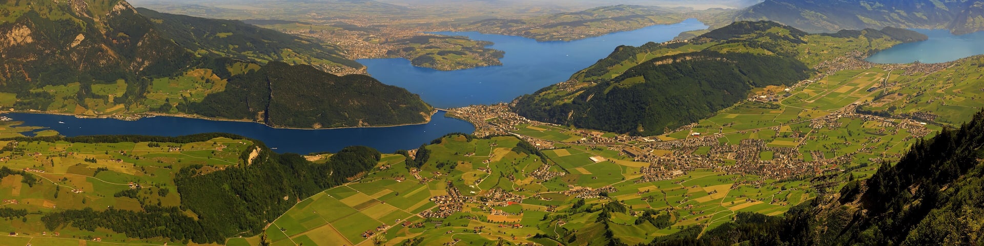 Magnificent panoramic aerial views of central Switzerland, mountains, Lake Lucerne as you ascend the Cabrio cable car up Mount Stanserhorn in Switzerland. City of Stans.