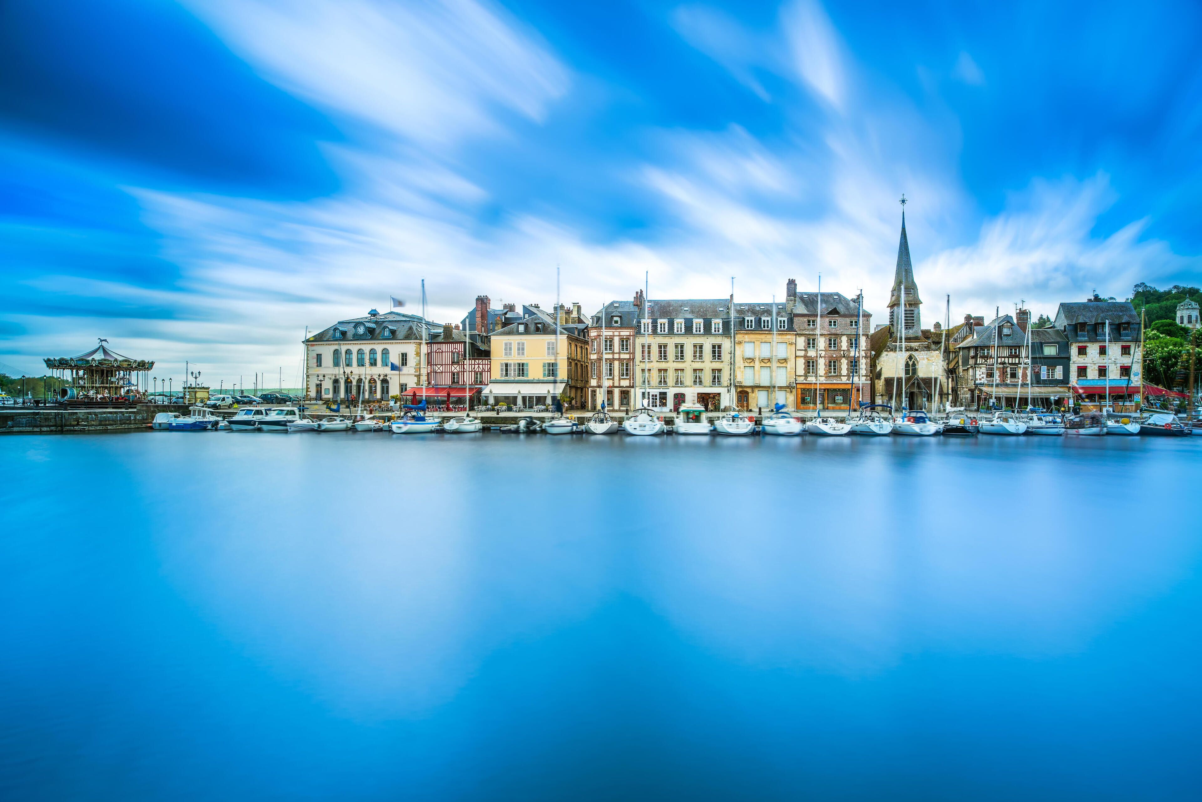 Honfleur famous village harbor skyline and water reflection. Normandy, France, Europe. Long exposure.