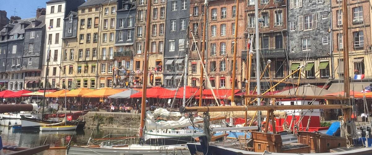 A harbor with tall buildings and boats.