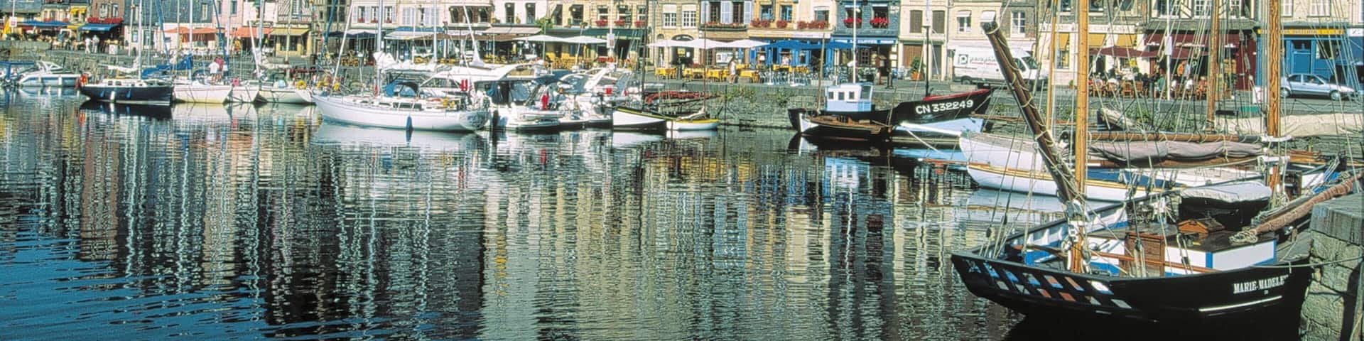 Honfleur featuring heritage architecture, a coastal town and a bay or harbour