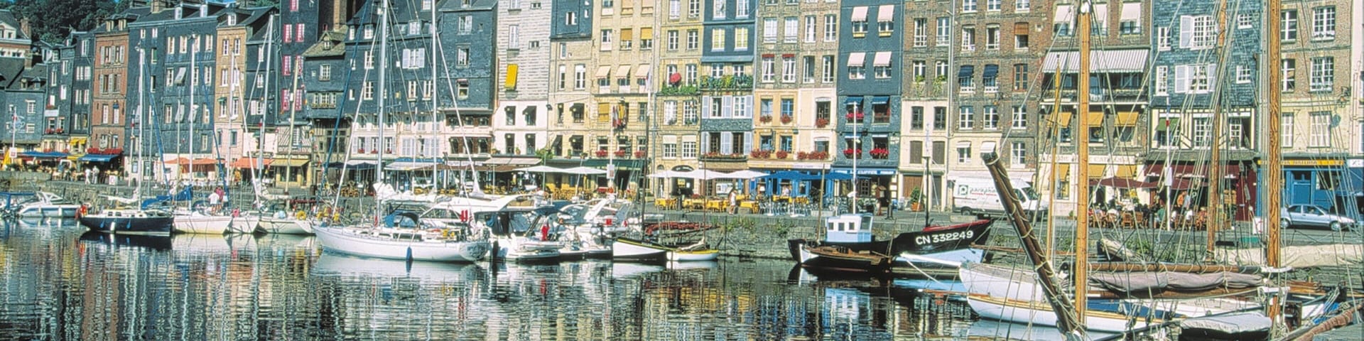 Honfleur featuring boating, a coastal town and heritage architecture