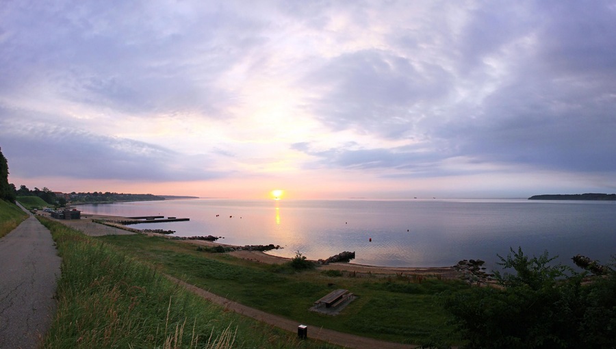 Sunrise over Kattegat strait in Fredericia city, Denmark. Kattegat is a sea strait connecting the North Sea and the Baltic Sea