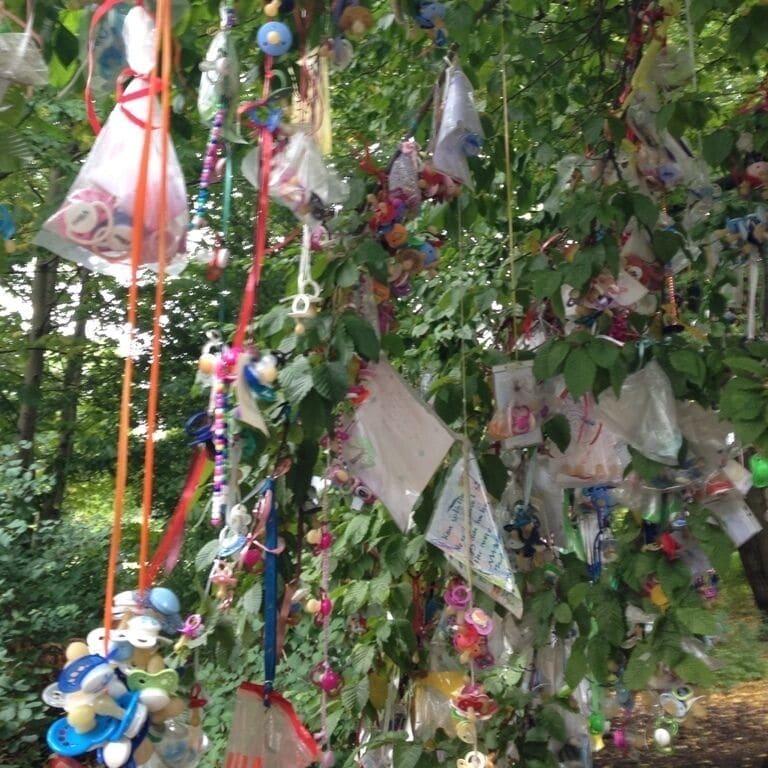 The pacifier tree in Frederiksberg, Denmark, on which young children hang their pacifiers when it's time for them to grow up!