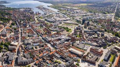 A panorama Aerial view around the old town in the city of Horsens in Denmark on a sunny summer noon