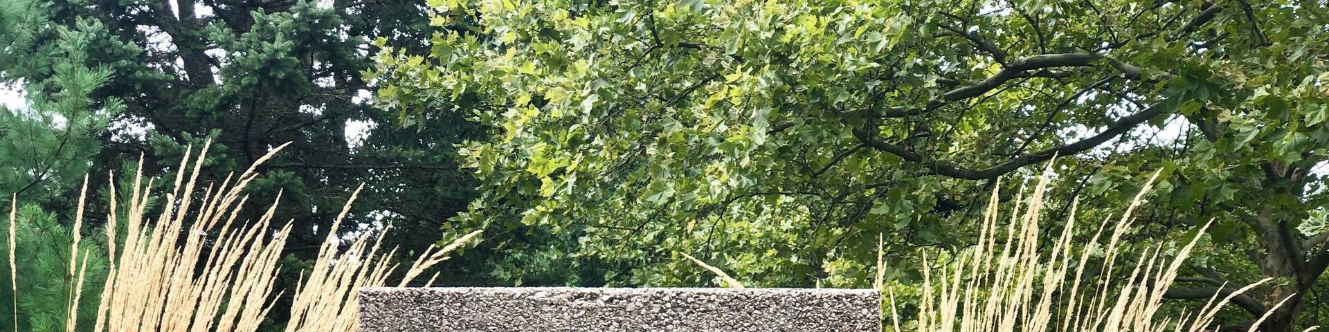 Parkwyn Village is a neighborhood of Kalamazoo, Michigan that was founded in the 1940s by a group of young scientists, employed at the Upjohn Company, who had a vision for a "congenial housing community." They purchased a 47-acre tract of land in 1946. By the fall of that year, they prevailed upon world-famous architect, Frank Lloyd Wright, to layout the community and design affordable houses they could build themselves.
The homeowners pooled their resources so that they could buy materials in bulk, make their own concrete blocks, and do some of the work of building the homes. Wright's site plan would accommodate 40 lots of approximately 1-acre in size.
Wright's Usonian style homes were designed to be modular with a large living room and fireplace, a convenient kitchen, indirect lighting, heated concrete floors and built-in furniture and closets. The walls would be constructed of inexpensive concrete blocks accented with mahogany trim and an extensive wall of windows overlooking a naturally landscaped yard. Designed to control costs, they would have no attic, basement, visible roof, garage, gutters or downspouts. While only four of Parkwyn's homes are pure Wright designs, his concepts influenced the majority of homes in the neighborhood.