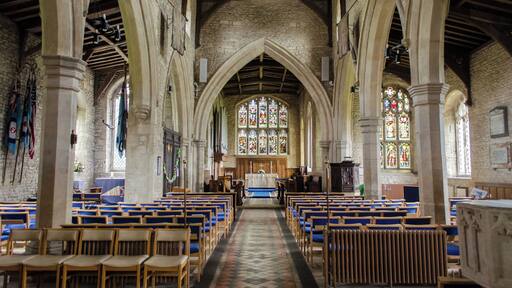 Grade II*listed The church dates from the 12th century onwards. There is a western tower with spire, nave with aisles and clerestory, chancel, vestry, and south porch. The tower dates from the late 13th century and is topped with a broach spire with lucarnes. It is 99 feet tall. A ring of six bells dates from 1598. The nave has three bays to the north and four to the south, and dates from the 14th century. The clerestory was added later, the line of the old roof being visible inside. The chancel is probably older but with perpendicular windows, the east window has stained-glass from circa 1890. The south porch was built in 1851 and originally had a priest's room over. The south door is Norman with zigzag patterning. There is a font with a base from circa 1200 and a later octagonal bowl. Originally there was a gallery and organ at the west end of the nave, but these were removed in 1866. The east part of the north aisle has been sectioned off as an RAF Memorial Chapel. It was dedicated in 1949. There are plans to create a meeting room in the north-west corner of the church.