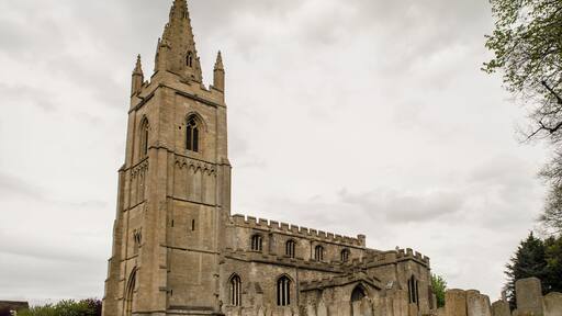 Grade I listed. The church dates from the 13th century onwards and consists of a fine 14th century tower of four stages with a spire, nave with aisles, transepts, chancel, north vestry and south porch. The nave has a late 13th century four bay north arcade, and an early 13th century four bay south arcade. The clerestory is perpendicular. The chancel, with fine sedilia and double piscina, dates from the 13th century, contemporary with the south transept. The north transept is slightly later, and contains a 13th century wall tomb. The south porch is from the 14th century. The font is in the 14th century style, and dates from 1895. There is also a late 17th-century oak pulpit. The church was restored in 1895.