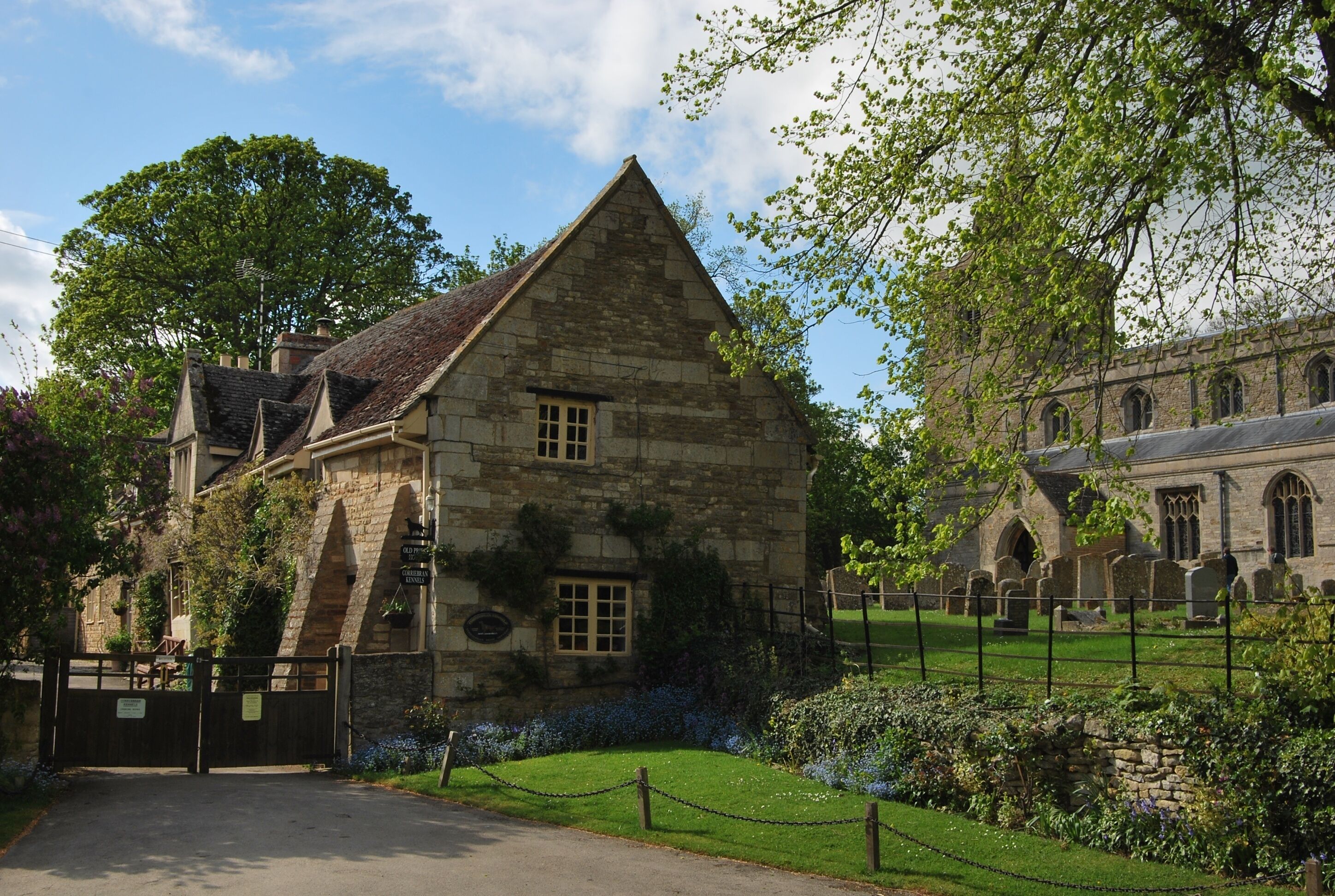 Hambleton, Rutland: the Old Priest's House (left) and Church of England parish church of St Andrew (right).