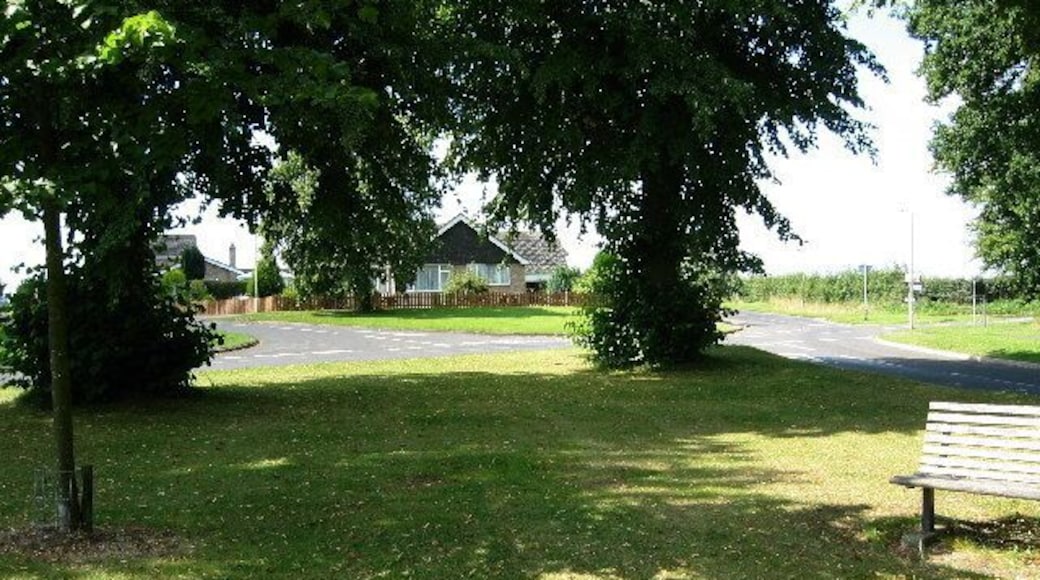 Cottesmore, Rutland. On the edge of the village between Ashwell Road and Burley Road there is a development of modern housing, visible here through the trees.