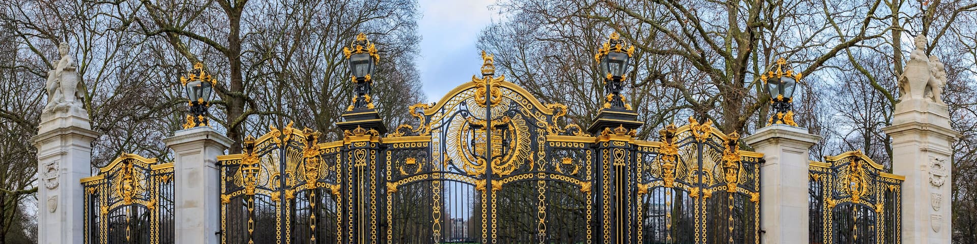 Ornate wrought iron and gold Canada Gate of the Green Park in front of the Buckingham Palace in London UK